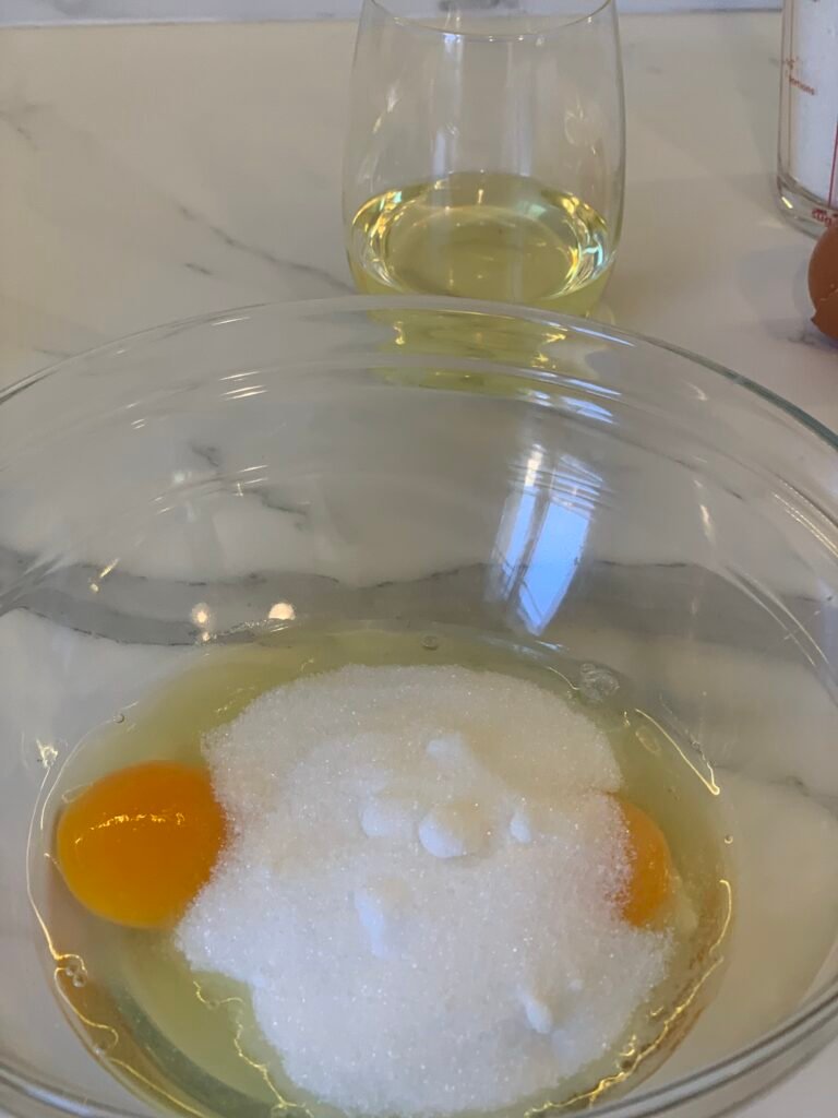 In a bowl, start mixing eggs and sugar